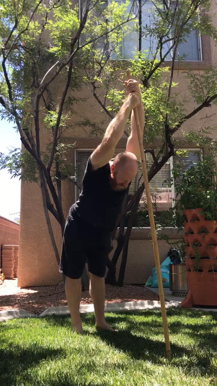 Shoulder mobility routine with a stick